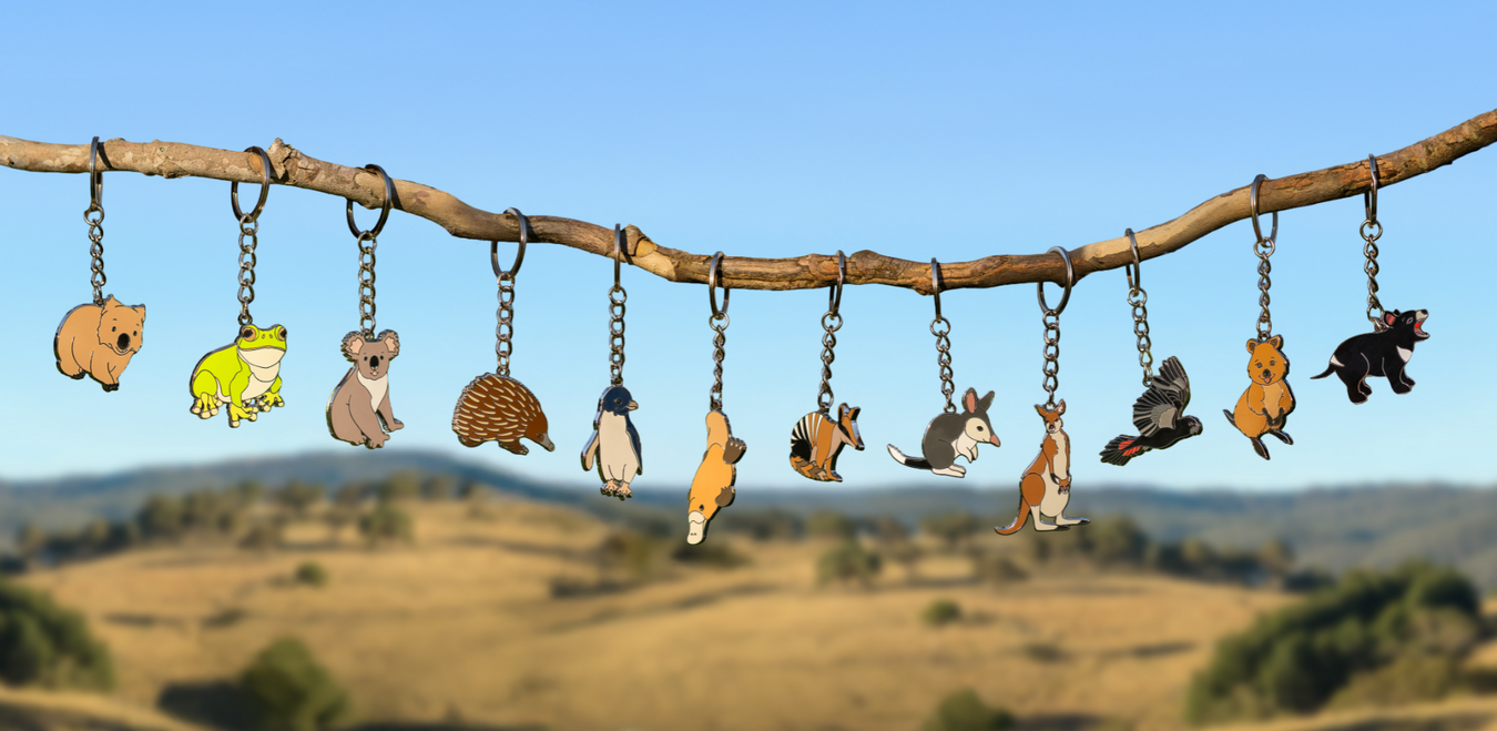 Australian Geographic animal keyrings hanging off a stick