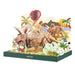 Dinosaur toy set in a colorful box with palm trees and plants on a white background
