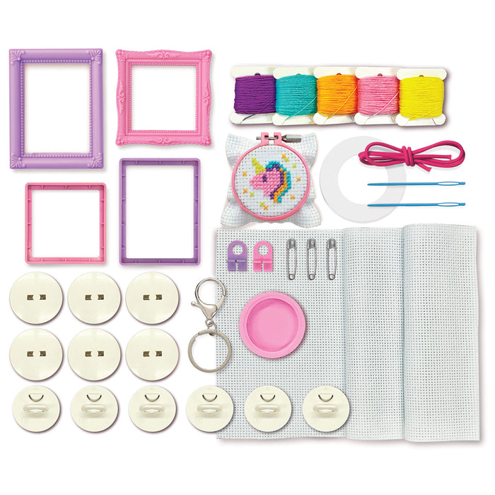 Crafting kit with frames, buttons, yarn, and other supplies on a white background