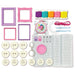 Crafting kit with frames, buttons, yarn, and other supplies on a white background