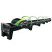 Model of a futuristic train on a track with green and black design