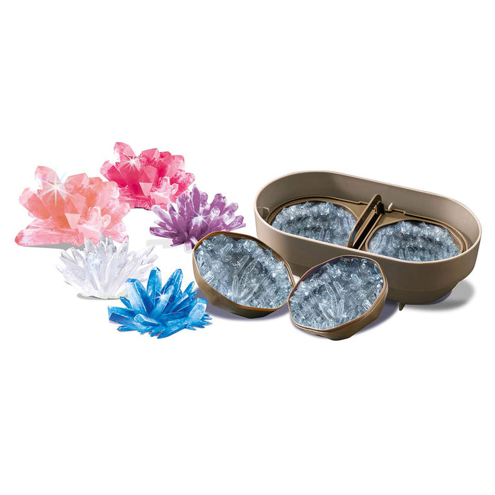 Decorative ice cube trays with colorful crystal-like ice cubes on a white background
