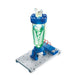 Science experiment setup with green liquid in a cylindrical container on a white background