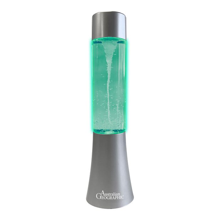 Lava lamp with green liquid and silver base on a white background