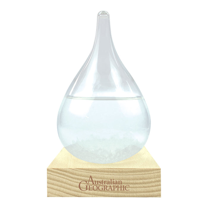Clear glass droplet on a wooden base with 'Australian Geographic' branding.