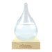 Clear glass droplet on a wooden base with 'Australian Geographic' branding.