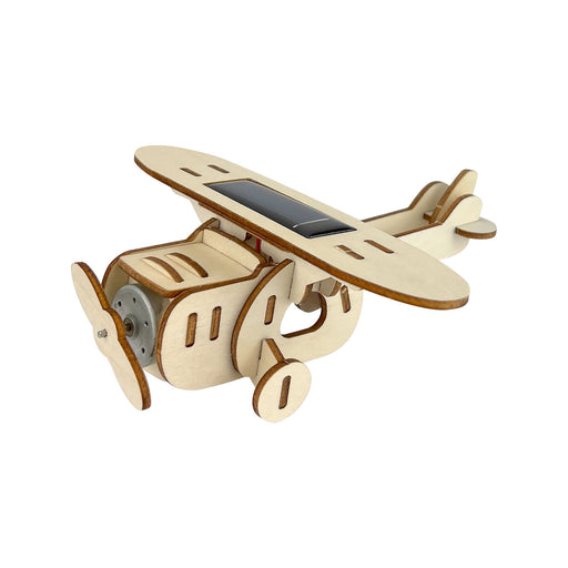 Wooden airplane model with solar panel on a white background