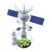 Satellite model with a small plant inside on a white background