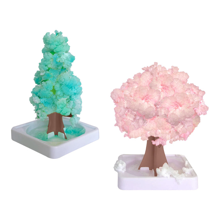 Two decorative trees, one green and one pink, on white bases with a white background.