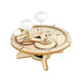 Wooden mechanical model with gears and balls on a white background