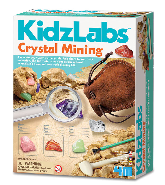 Box of KidzLabs Crystal Mining kit with magnifying glass, crystals, and tools on a white background