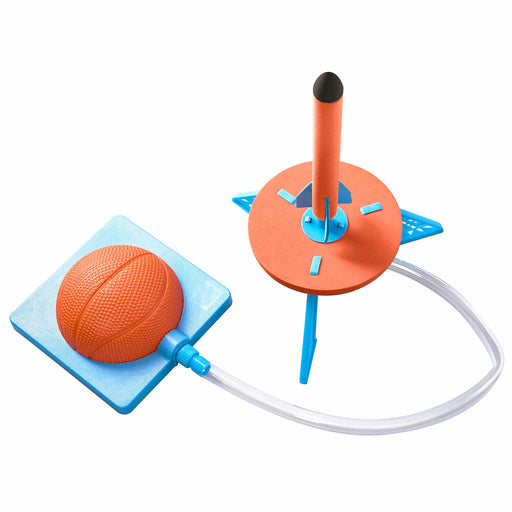 Toy basketball hoop with orange ball on a white background