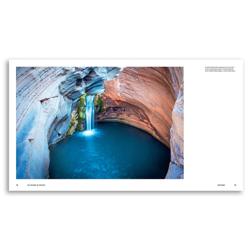 A landscape art print featuring a photograph of a waterfall flowing into a deep blue pool inside a rocky canyon, presented on a white page within a square mockup.