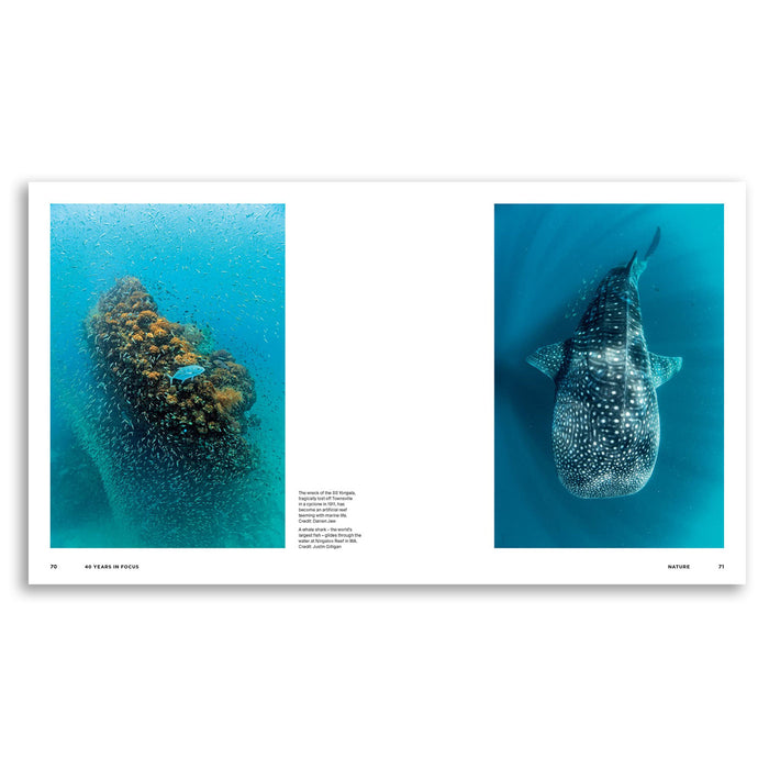 A two-page spread from a Nature magazine featuring underwater photographs of a whale shark and a coral reef with a small blue fish, presented on a white background.