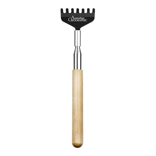 Retractable beard comb with wooden handle and black metal head on a white background