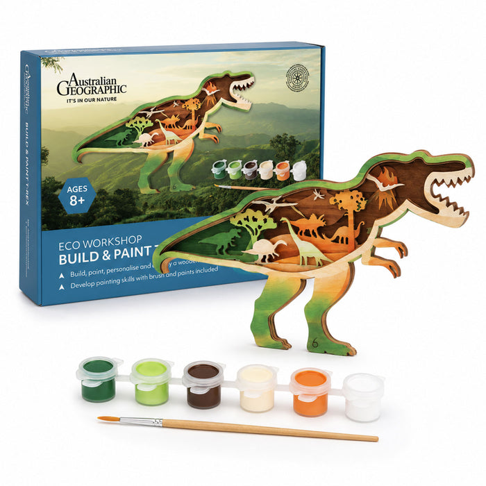Australian Geographic Eco Workshop Build & Paint dinosaur activity kit, featuring a wooden T-rex model with painted and printed internal dinosaur details, shown with its blue retail box and paint pots on a white background.
