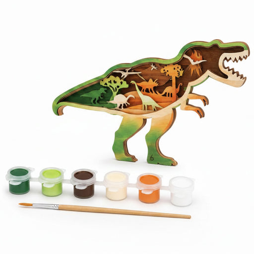 A wooden dinosaur painting kit showing a T-rex silhouette filled with layered dinosaur and prehistoric scene designs, alongside six small paint pots and a paintbrush on a white background.