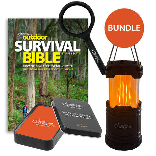 Outdoor survival bundle with 'Survival Bible', lantern, and playing cards on a white background