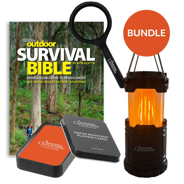 Outdoor survival bundle with 'Survival Bible', lantern, and playing cards on a white background