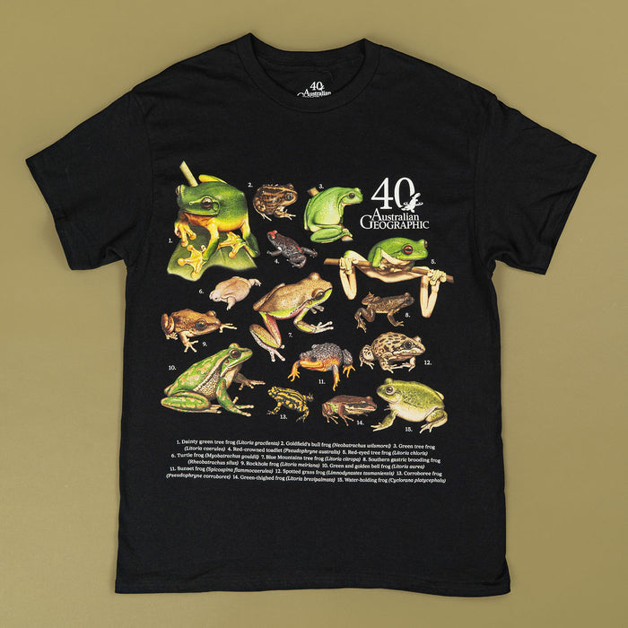 Black t-shirt with frog illustrations and 'Australian Geographic' branding on a beige background