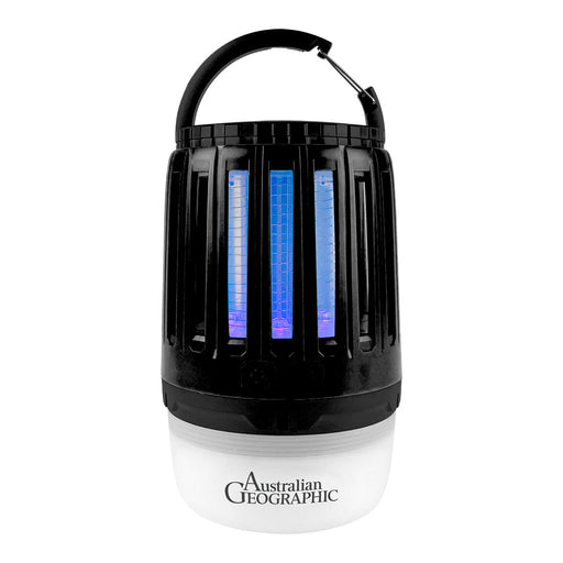 Australian Geographic electric fly trap lantern with a black body, blue and purple glowing insect-catching grids, a black carrying handle, and a white base with the brand logo.