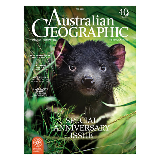 Australian Geographic magazine cover with a Tasmanian devil in the grass
