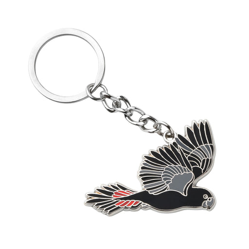 Keychain with a black cockatoo design on a white background