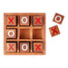 Wooden blocks with 'X' and 'O' symbols in a wooden box on a white background