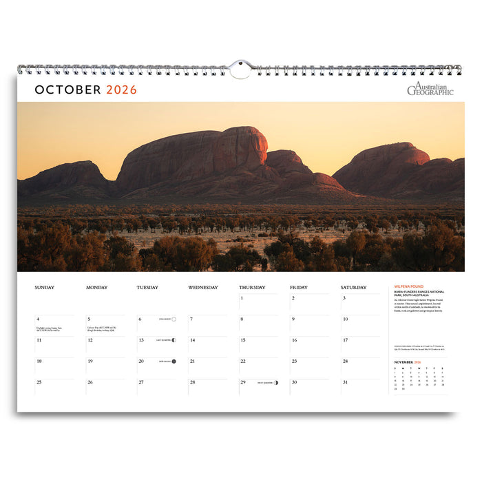 Calendar for October 2026 with a scenic landscape of mountains and trees.