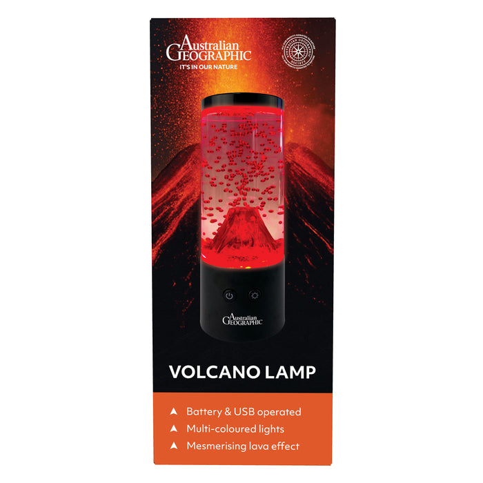 Australian Geographic Volcano Lamp in its retail packaging, featuring a lava lamp with red liquid and volcanic mountain graphics on a black background with an orange bottom banner.