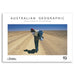 Australian Geographic 2026 photo calendar cover with a person in a hat and coat standing on a dirt road.