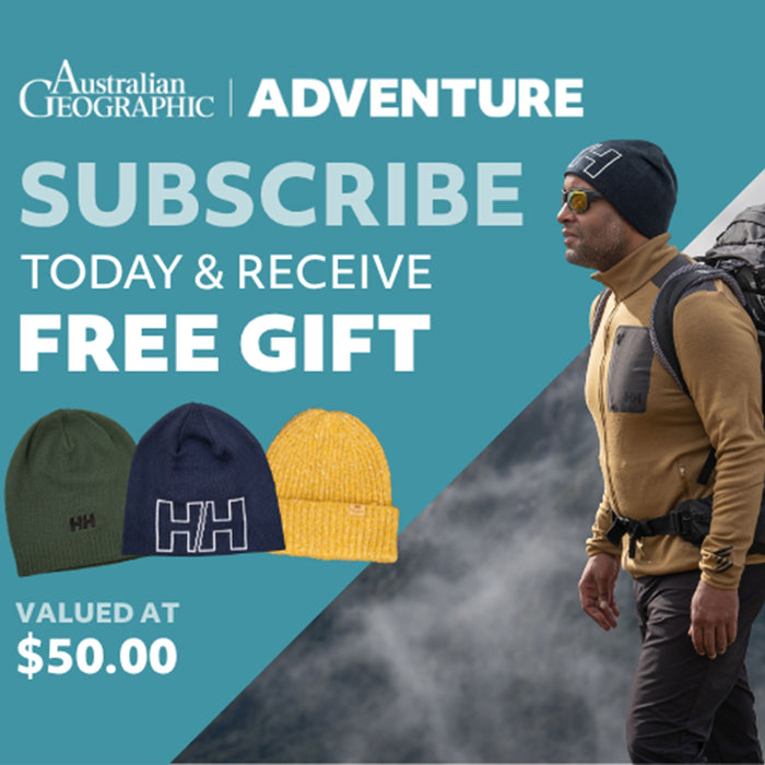 Advertisement for Australian Geographic with a man in outdoor gear and hats on a mountain background.