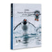 A hardcover book titled "Nature Photographer of the Year" by Australian Geographic, featuring a penguin splash photograph on the cover and a blue spine, shown on a white background.