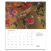 A spiral-bound January 2027 wall calendar page featuring a detailed nature photograph of a small bird perched on a branch with pink flowers, above a white calendar grid and text.