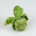 Green plush turtle toy on a white background