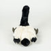 A black and white fluffy stuffed animal toy, photographed from the back against a clean white background.