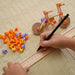 Children's educational toy set with building blocks and a ruler on a textured surface.
