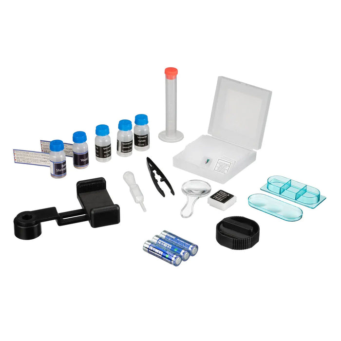 A comprehensive kit of small sample vials, reagents, tools, and storage containers arranged on a plain white background. The kit includes several small bottles with blue caps, a white plastic box with a clear lid, a clear cylindrical tube with a red cap, a black magnifying lens holder, two small clear plastic organizer trays, a black cap, a white dropper, a small clear magnifying glass, a small digital scale, and three blue batteries.