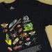 A black short-sleeve graphic T-shirt laid flat on a beige background, featuring a large illustrated collection of insects and the text '40 Australia Geographic' on the chest.