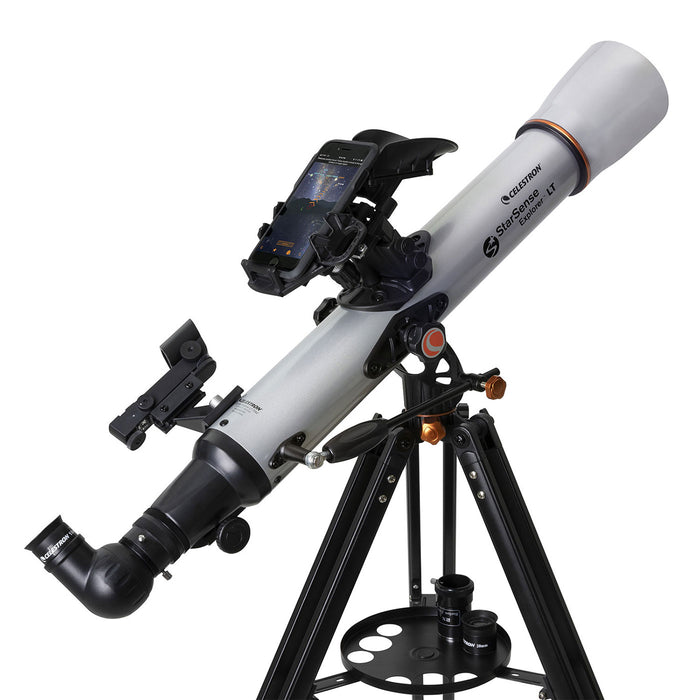 Telescope with a white tube and black tripod on a white background