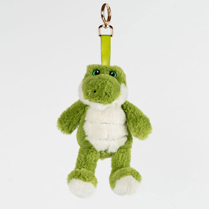 Green plush crocodile keychain on a white background