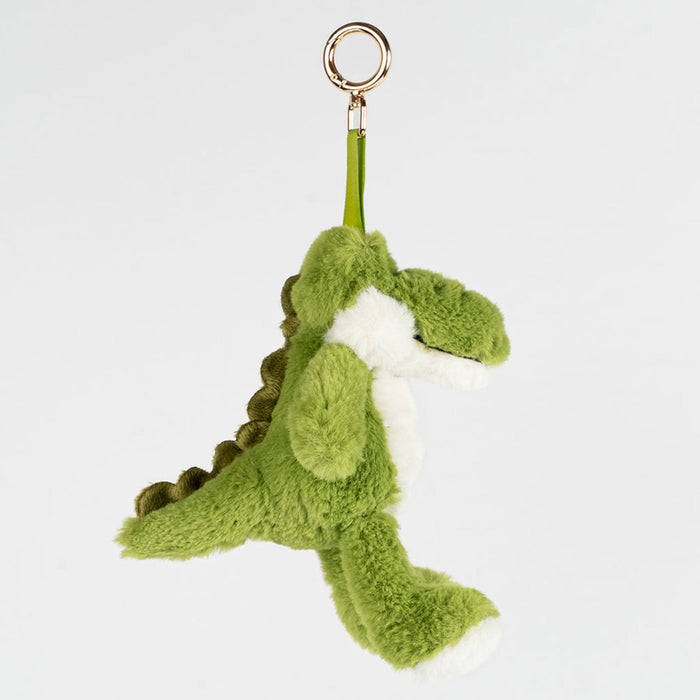 Green plush crocodile keychain on a white background