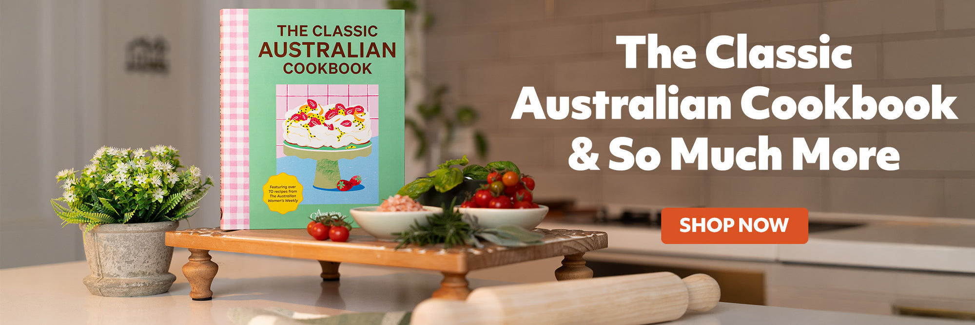 Book titled 'The Classic Australian Cookbook' on a table with promotional text and call to action.