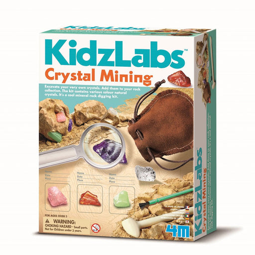 Box of KidzLabs Crystal Mining kit with magnifying glass, crystals, and tools on a white background