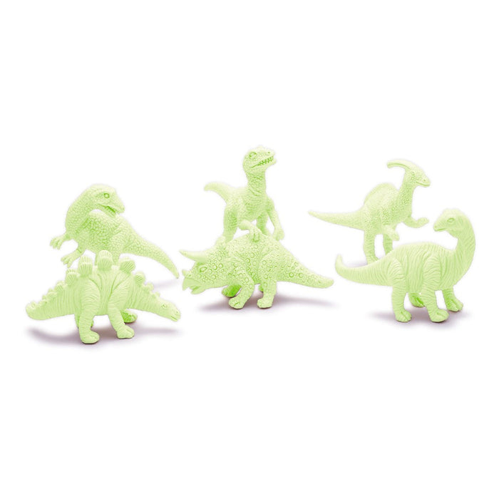 Set of glow-in-the-dark dinosaur toys on a white background