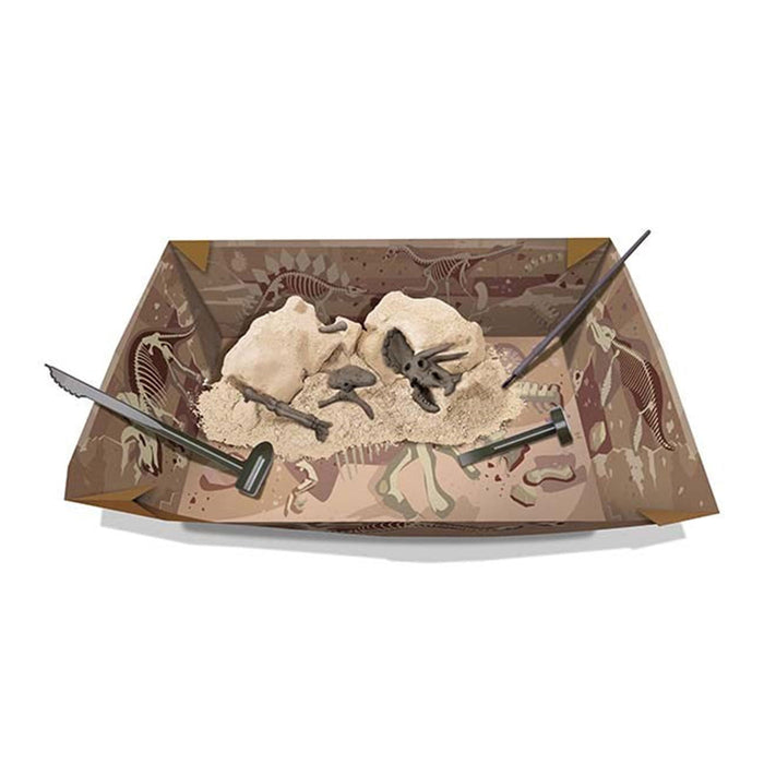 Dinosaur excavation kit with fossils and tools on a decorative box