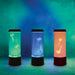 Three cylindrical lamps with jellyfish designs in green, blue, and orange on a gradient blue background.