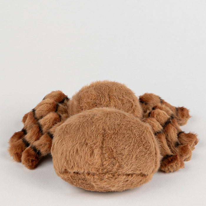 Brown plush toy resembling a spider on a white background