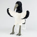 Plush toy ibis on a clear glass stand against a white background