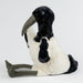 Plush toy ibis with a large beak on a white background